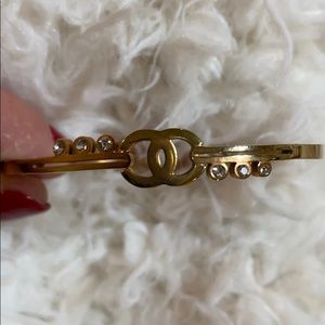 Channel like bracelet and earrings.